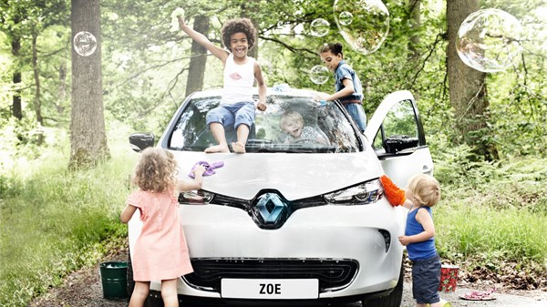Kids playing with Renault ZOE electric car